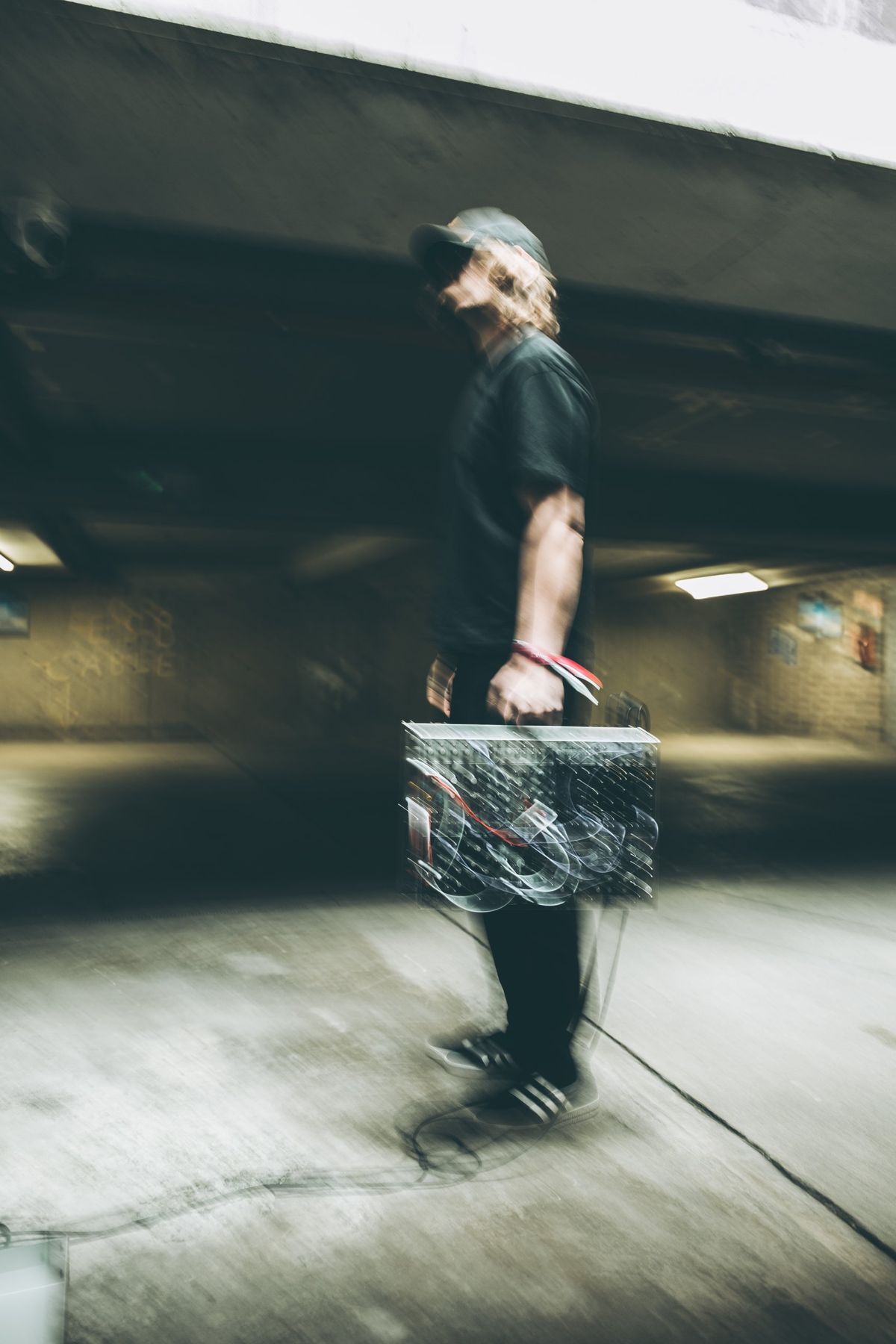 Motion-blurred portrait carrying the modular case
